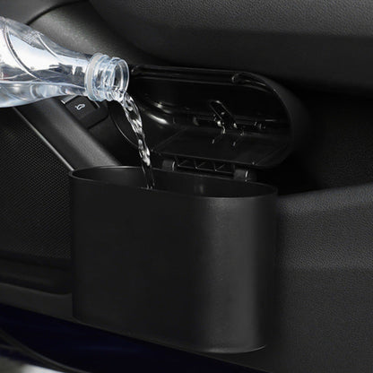 Car cup holder with water being poured into it, showing its capacity and design.
